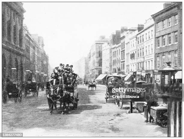 antique travel photographs of london: the strand - bus livery stock illustrations