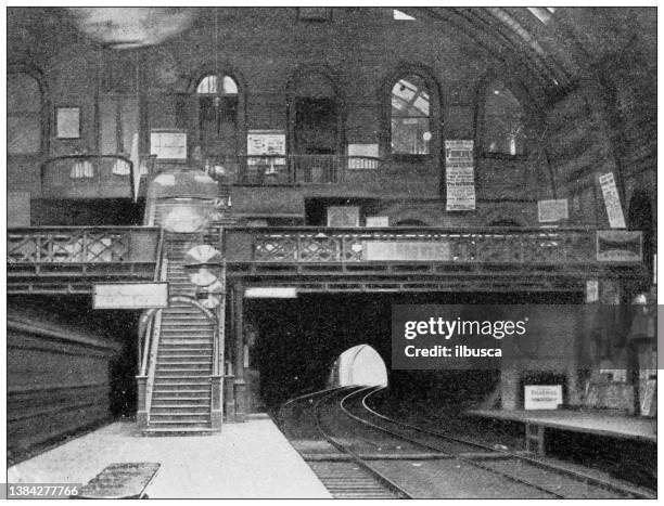 antique travel photographs of london: underground station - london train station stock illustrations
