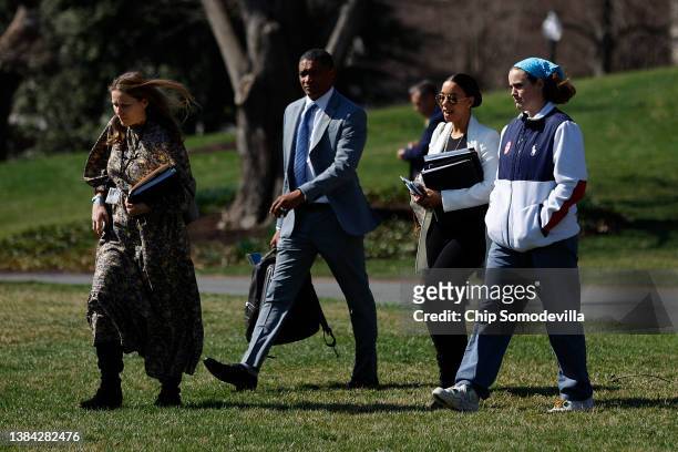 White House Communications Director Kate Bedingfield, Senior Advisor Cedric Richmond, Special Assistant to the President Ashley Williams and U.S....