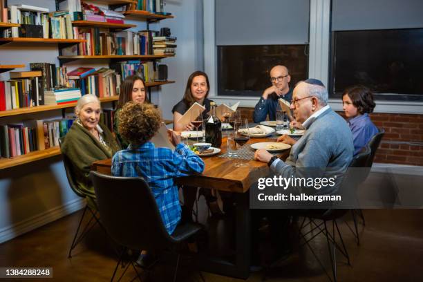 family seder at home on passover - jewish celebration stock pictures, royalty-free photos & images