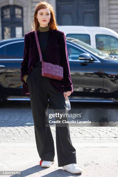 Jadi Wegener wearing a purple velvet blazer, grey pants, black and olive green turtleneck sweater and burgundy Bottega Veneta bag, is seen outside...