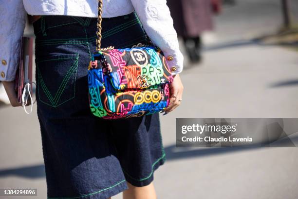 Guest wearing colorful printed Chanel bag, is seen outside Chanel, during Paris Fashion Week - Womenswear F/W 2022-2023 on March 08, 2022 in Paris,...