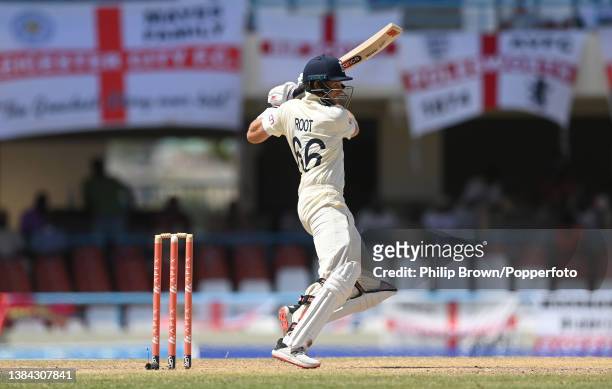 Joe Root of England bats during the fourth day of the first Test against West Indies at Sir Vivian Richards Stadium on March 11, 2022 in Antigua,...