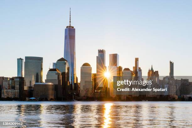 new york city skyline at sunrise, usa - world trade center manhattan stock-fotos und bilder