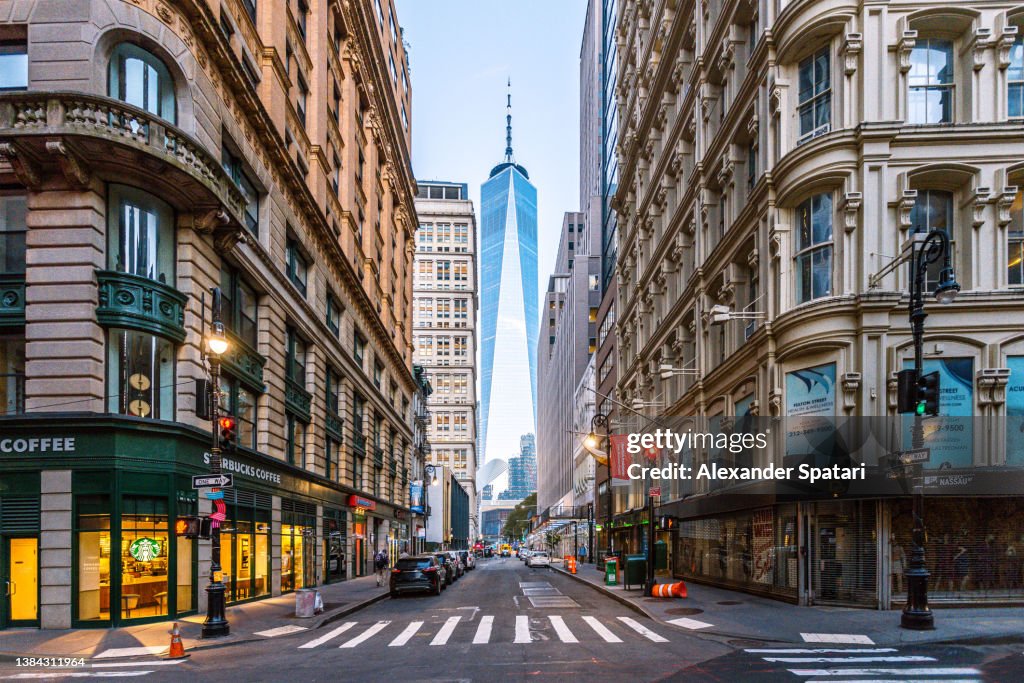 Street in Manhattan Downtown with One World Trade Center in the middle, New York City, USA