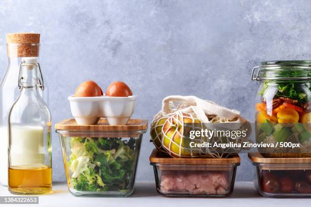 glass boxes and cans with fresh food refrigerator storage concept - packed lunch - fotografias e filmes do acervo
