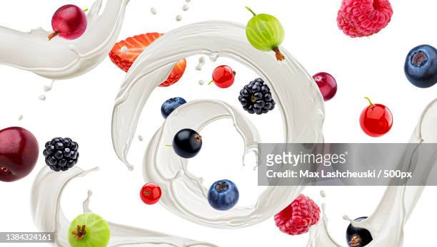 wild berries with milk splash isolated on white background - blackberry fruit pattern stock pictures, royalty-free photos & images
