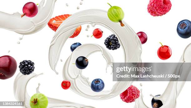 wild berries with milk splash isolated on white background - milk pack 個照片及圖片檔