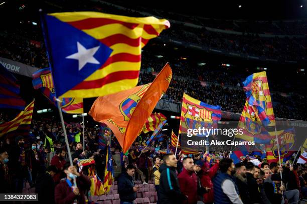 Barcelona supporters wave their flags during the UEFA Europa League Round of 16 Leg One match between FC Barcelona and Galatasaray at Camp Nou on...