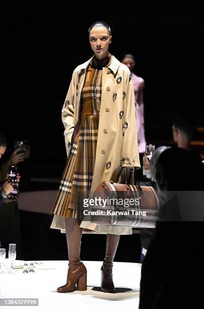 Model walks the runway of the Burberry A/W 2023 Womenswear Collection Presentation at Central Hall Westminster on March 11, 2022 in London, England.