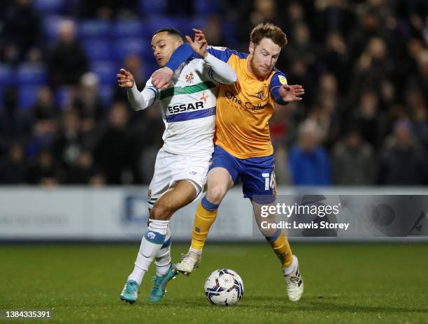 Josh Dacres-Cogley of Tranmere Rovers battles for possession with Stephen Quinn of Mansfield Town during the Sky Bet League Two match between...