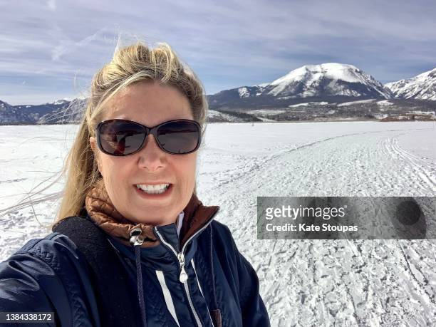 woman on a frozen lake. - winter sport walk old stock pictures, royalty-free photos & images