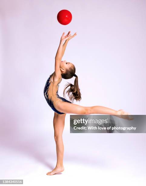 rhythmics gymnast girl 11 years old exercising ball routine - 12 13 years girls stock pictures, royalty-free photos & images