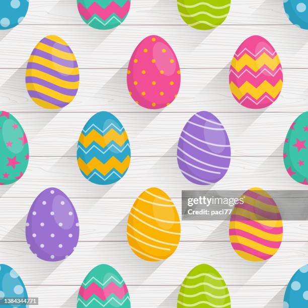 seamless pattern of easter eggs with wood background - easter pattern background stock illustrations