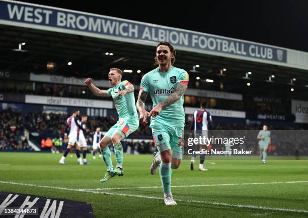 Danny Ward of Huddersfield Town celebrates after scoring the second goal with team mate Lewis O'Brien during the Sky Bet Championship match between...