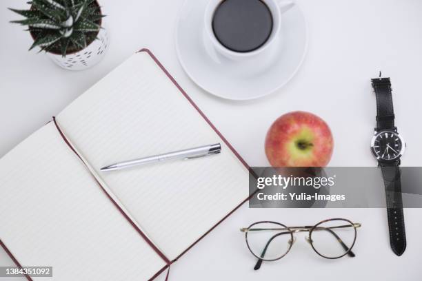 open notebook with pen, apple, coffee and watch - office work flat lay stock pictures, royalty-free photos & images