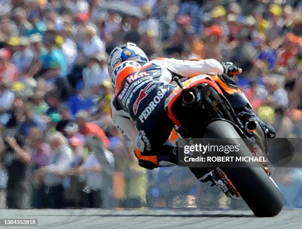 Spain's Dani Pedrosa of the Repsol Honda team steers his bike during the qualifying of the Moto Grand Prix at the Sachsenring Circuit on July 16,...