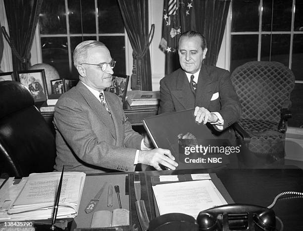 Pictured: President Harry S. Truman presented with the Roosevelt Album by NBC President Niles Trammell in the Oval Office of the White House on May...