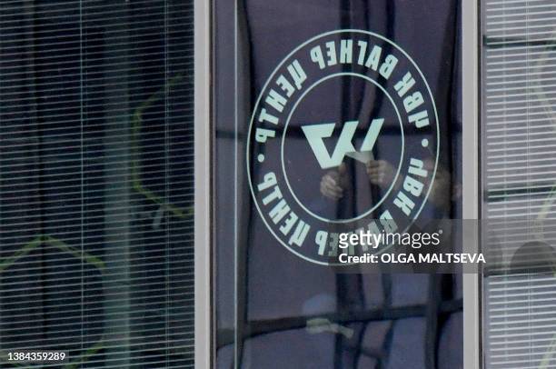 Employees remove the PMC Wagner Centre logos from their closed office in Saint Petersburg, on July 2, 2023. Wagner chief 'betrayed' Russia out of...
