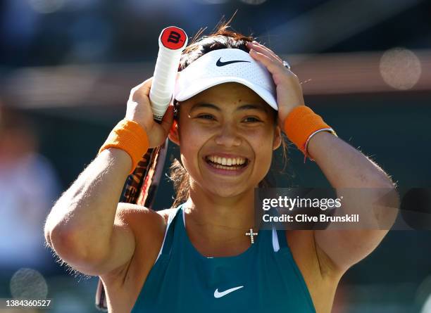 Emma Raducanu of Great Britain celebrates match point against Caroline Garcia of France in their second round match on Day 5 of the BNP Paribas Open...