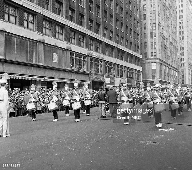 Pictured: A marching band passes by during the 1954 Macy's Thanksgiving Day Parade