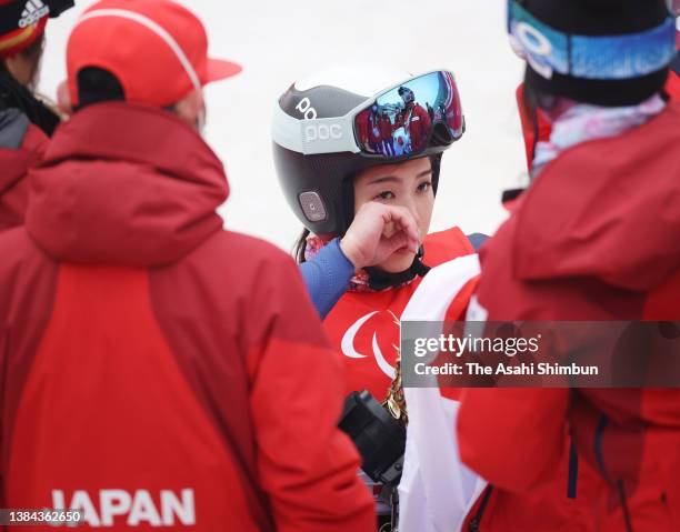 Gold medallist Momoka Muraoka of Team Japan celebrates after the flower ceremony for the Para Alpine Skiing Women's Giant Slalom Sitting during day...