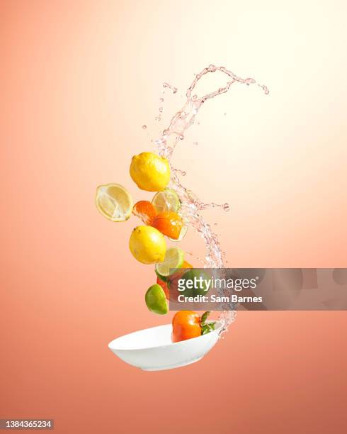 citrus fruit mid-air - lemon peel stock pictures, royalty-free photos & images