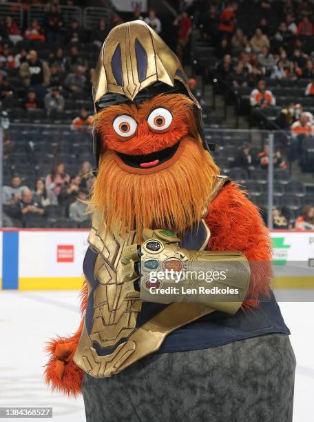 Gritty the mascot of the Philadelphia Flyers on Marvels Super Hero Day entertains the crowd during the first period intermission against the Chicago...