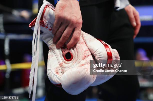 The gloves of Marc Leach are seen with blood on after the British Super Bantamweight Title fight between Chris Bourke and Marc Leach at York Hall on...