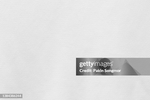 Fabric for sports clothing in a white color, the texture of a football shirt jersey, and a textile background Fabric for sports clothing in a white color, the texture of a football shirt jersey, and a textile background