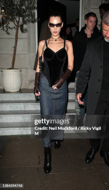 Bella Hadid and Marc Kalman seen attending a Burberry dinner at The Twenty Two on March 11, 2022 in London, England.