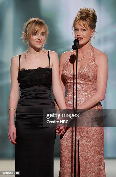 Pictured: Dakota Johnson, Miss Golden Globe, and Melanie Griffith on stage during The 63rd Annual Golden Globe Awards at the Beverly Hilton Hotel.