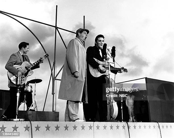 Episode 10 -- aired -- Pictured: Guitarist, Scotty Moore, host Milton Berle, musician Elvis Presley on the deck of the USS Hancock aircraft carrier.