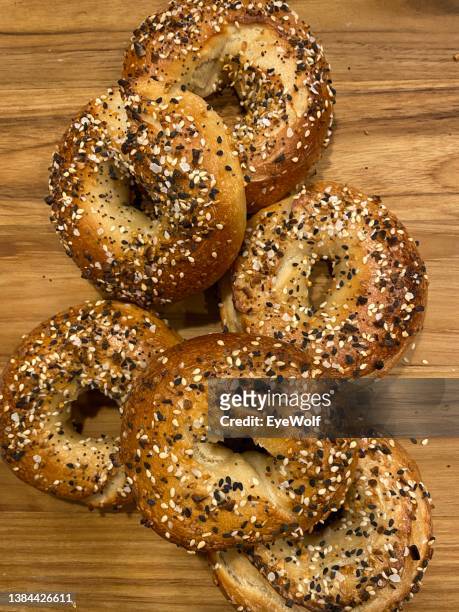 Homemade everything bagels on a cutting board