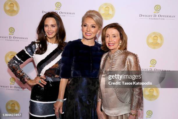 Lynda Carter, Julie Opperman, and U.S. House Speaker Nancy Pelosi at the Justice Ruth Bader Ginsburg Woman of Leadership Award on March 11, 2022 in...