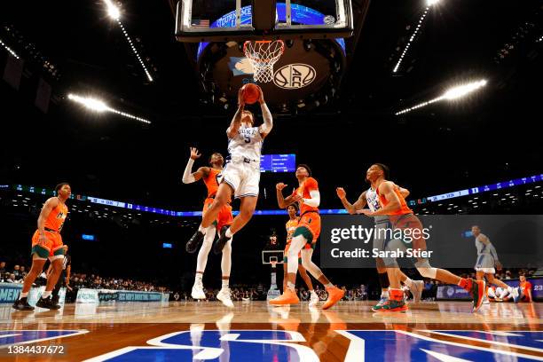 Paolo Banchero of the Duke Blue Devils goes to the basket during the second half against the Miami Hurricanes in the 2022 Men's ACC Basketball...
