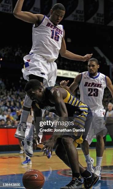 Moses Morgan of the DePaul Blue Demons collides with Darius Johnson-Odom of the Marquette Golden Eagles at Allstate Arena on February 6, 2012 in...