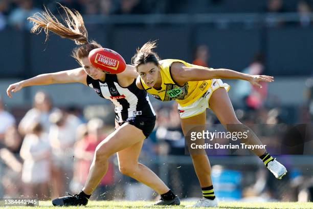 Alana Porter of Collingwood and Monique Conti of Richmond compete during the round 10 AFLW match between the Collingwood Magpies and the Richmond...