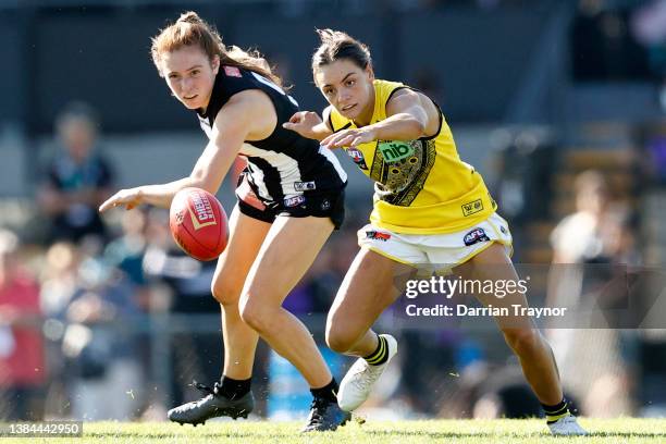 Alana Porter of Collingwood and Monique Conti of Richmond compete during the round 10 AFLW match between the Collingwood Magpies and the Richmond...