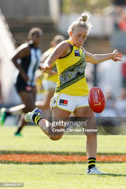 Kodi Jacques of Richmond kicks the ball during the round 10 AFLW match between the Collingwood Magpies and the Richmond Tigers at Victoria Park on...