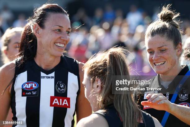 Alison Downie and Brianna Davey of Collingwood celebrate their teams win after the round 10 AFLW match between the Collingwood Magpies and the...