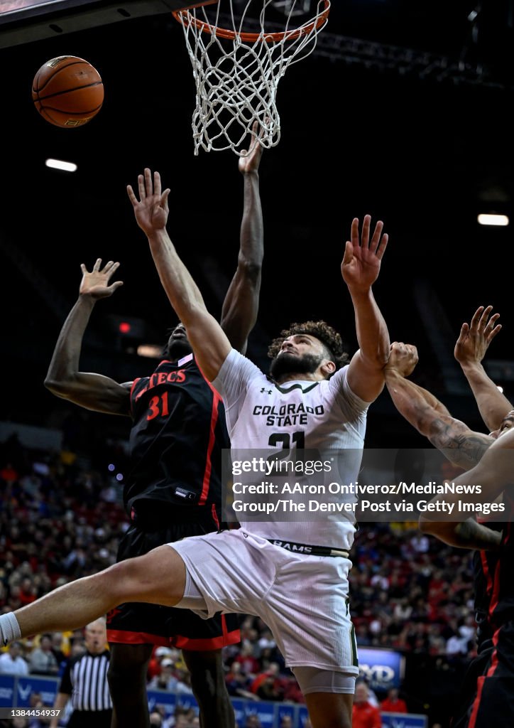 David Roddy Of The Colorado State Rams Scores Over Nathan Mensah Of david-roddy-of-the-colorado-state-rams-scores-over-nathan-mensah-of