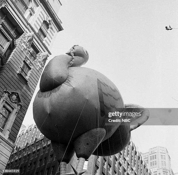 Pictured: Large balloons pass overhead during the 1954 Macy's Thanksgiving Day Parade