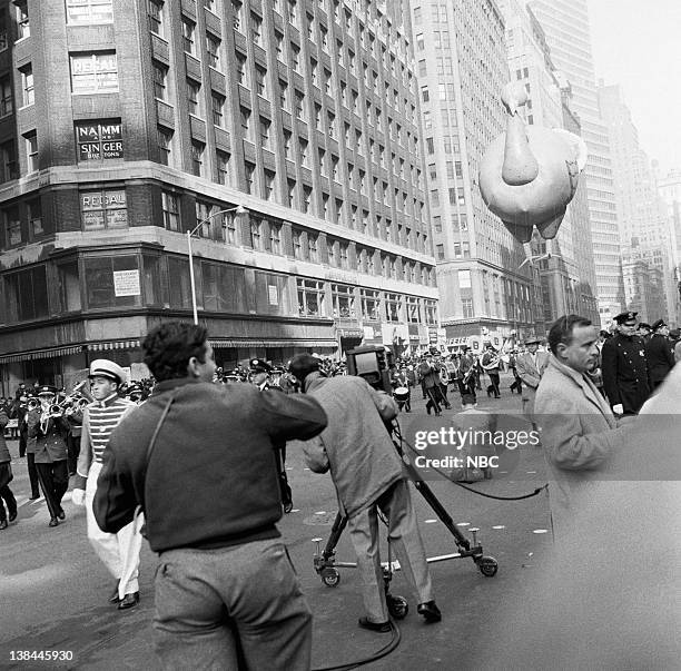 Pictured: Large balloons pass overhead during the 1954 Macy's Thanksgiving Day Parade