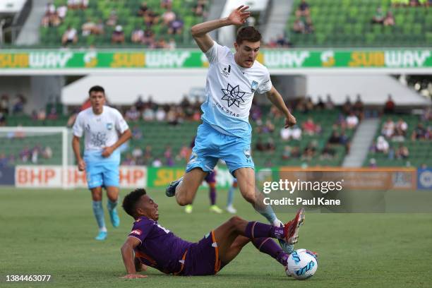 Antonee Burke-Gilroy of the Glory tackles Max Burgess of Sydney during the A-League Mens match between Perth Glory and Sydney FC at HBF Stadium, on...