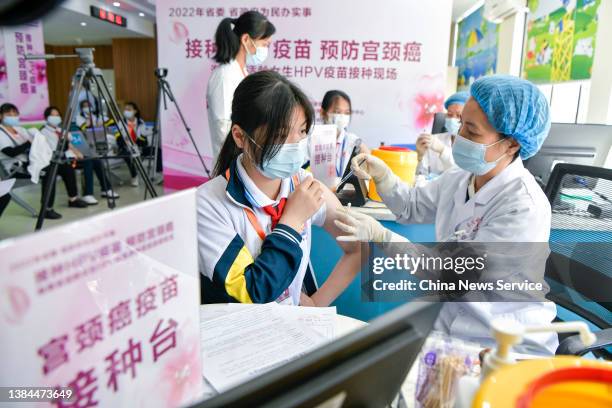 Girl receives her first dose of the human papillomavirus vaccine at a hospital on March 12, 2022 in Haikou, Hainan Province of China. Hainan province...