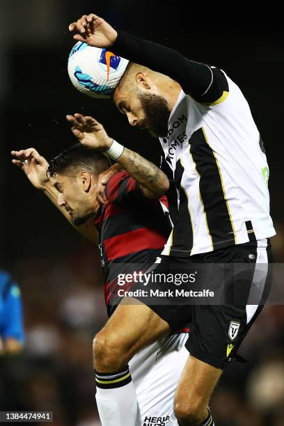 Tomislav Uskok of the Bulls beats Tomer Hemed of the Wanderers to a header during the A-League Mens match between Macarthur FC and Western Sydney...