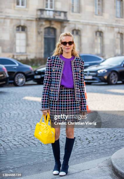 Blanca Miro Scrimieri wearing purple jacket, checkered mini skirt, purple jumper, yellow bag, knee high boots seen outside Chanel during Paris...