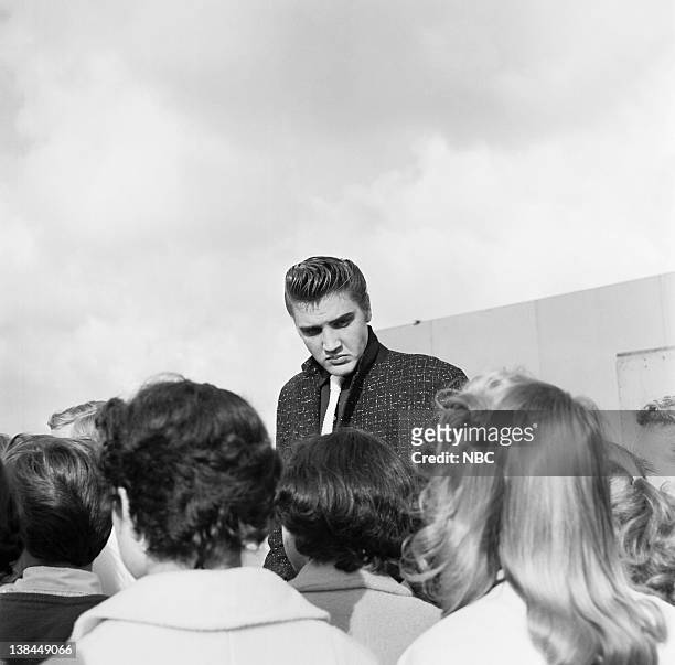 Episode 10 -- aired -- Pictured: Musician Elvis Presley and fans on the deck of the USS Hancock aircraft carrier.