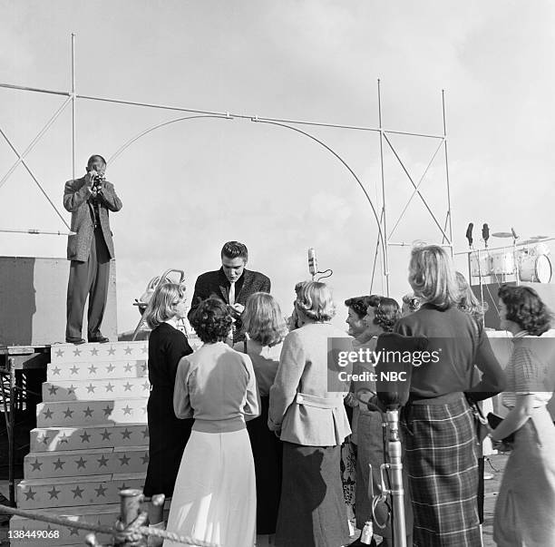 Episode 10 -- aired -- Pictured: Musician Elvis Presley and fans on the deck of the USS Hancock aircraft carrier.